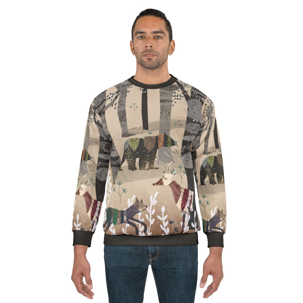 Watercolor illustration of forest animals on a beige sweatshirt