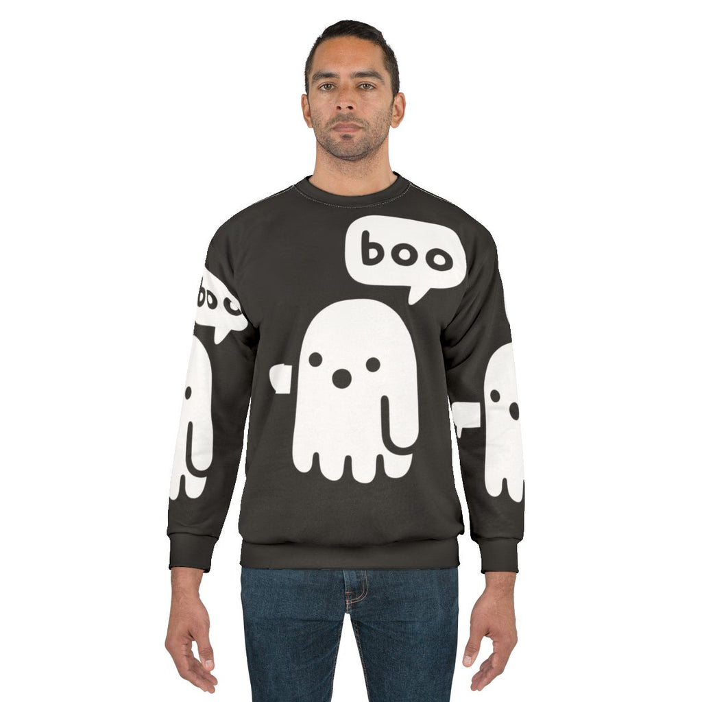 Spooky ghost graphic on a black sweatshirt