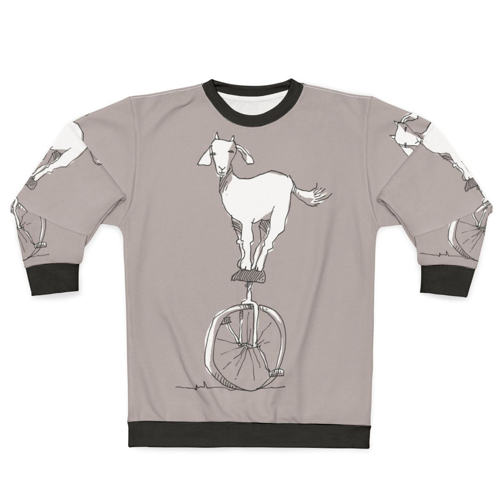 Goat on a unicycle printed on a cozy sweatshirt