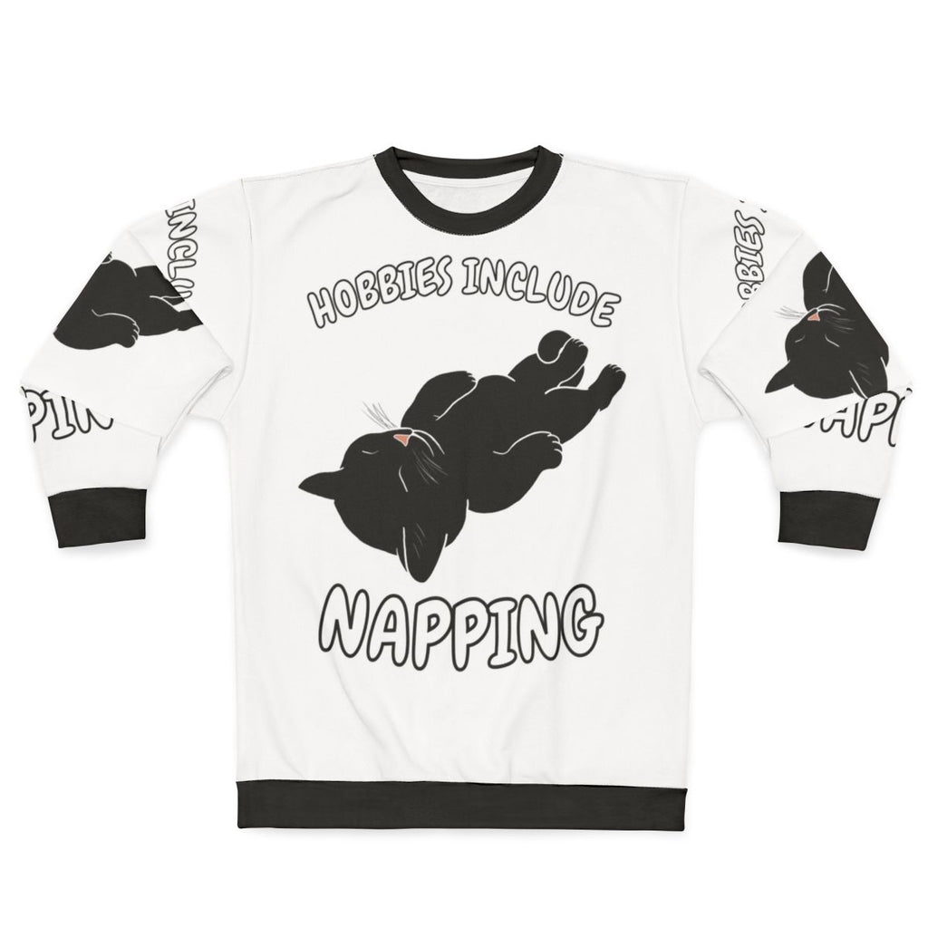 A black cat sweatshirt with the text "Hobbies Include Napping"