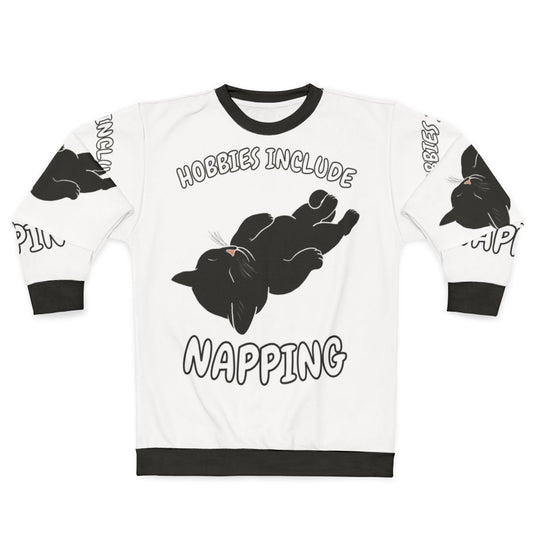 A black cat sweatshirt with the text "Hobbies Include Napping"