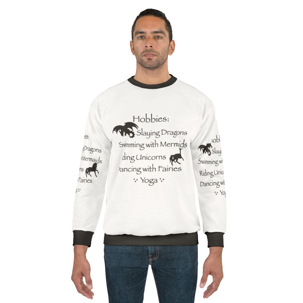 Magical hobbies sweatshirt featuring fantasy elements like dragons, mermaids, and fairies