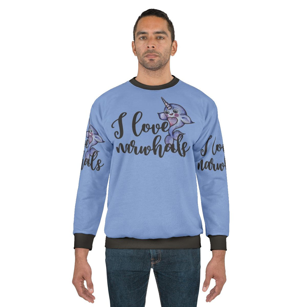 Soft pink and purple sweatshirt with a cute narwhal graphic