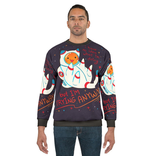 Cat astronaut wearing a cozy sweatshirt with a positive affirmation