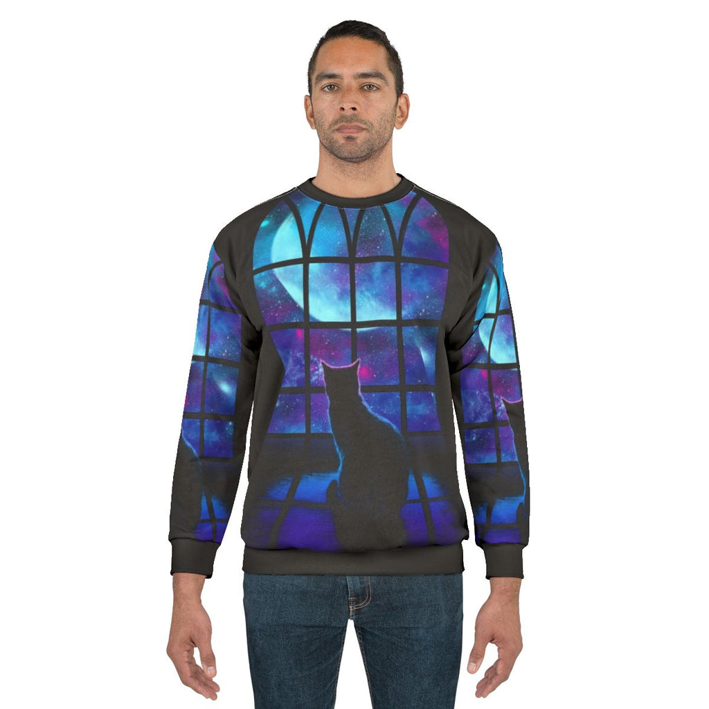 A stylish space-themed sweatshirt with a cute cat design