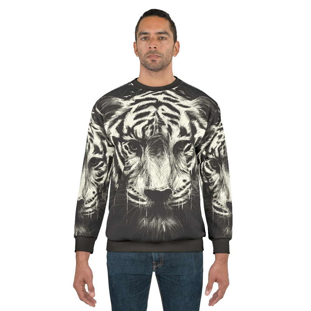Interconnected sweatshirt with surreal, photorealistic tiger and bird graphics