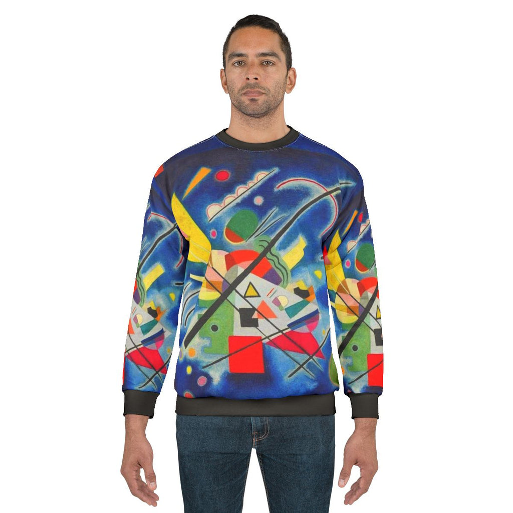 Kandinsky-inspired blue abstract art design on a sweatshirt