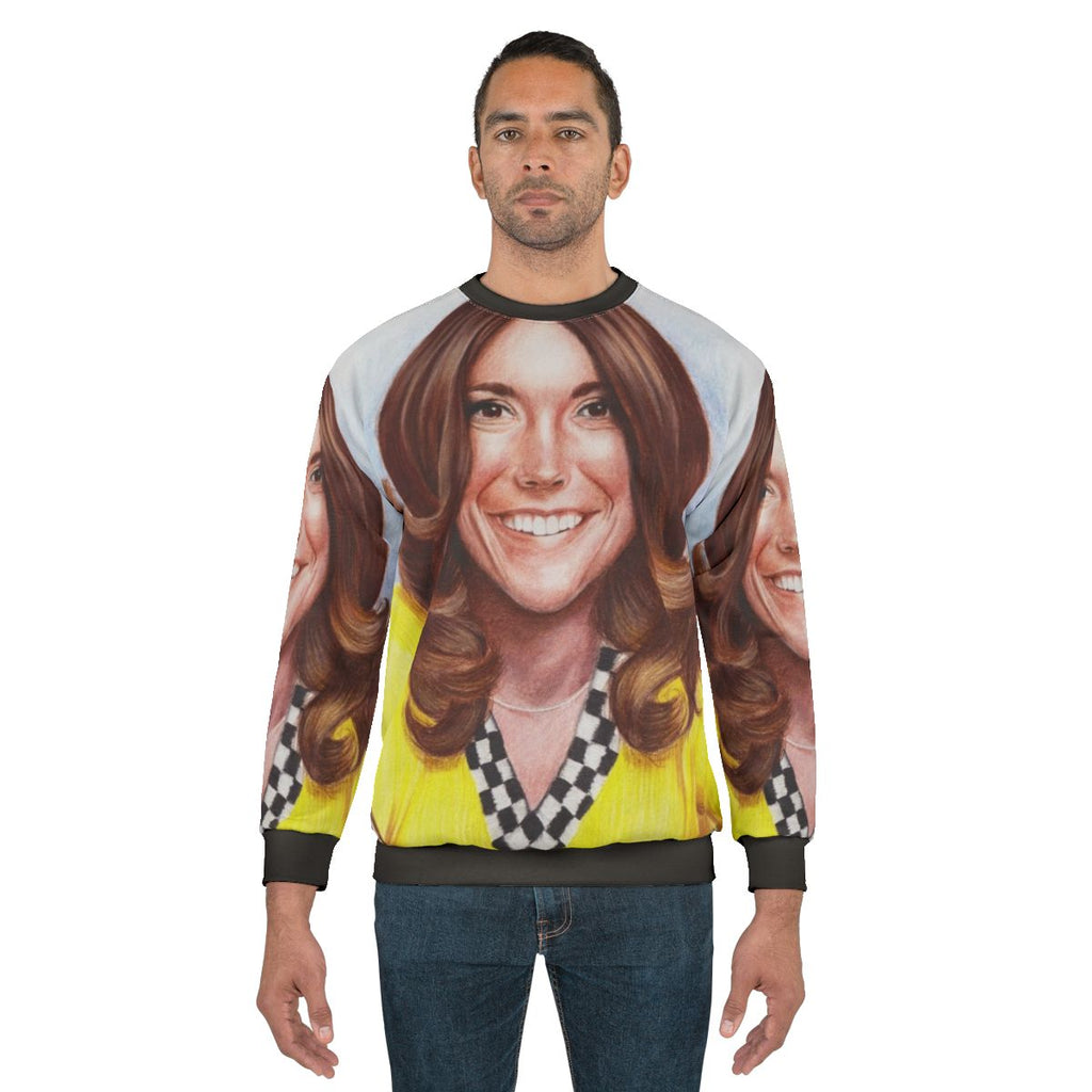 Karen Carpenter, the Carpenters musician, wearing a retro yellow sweatshirt