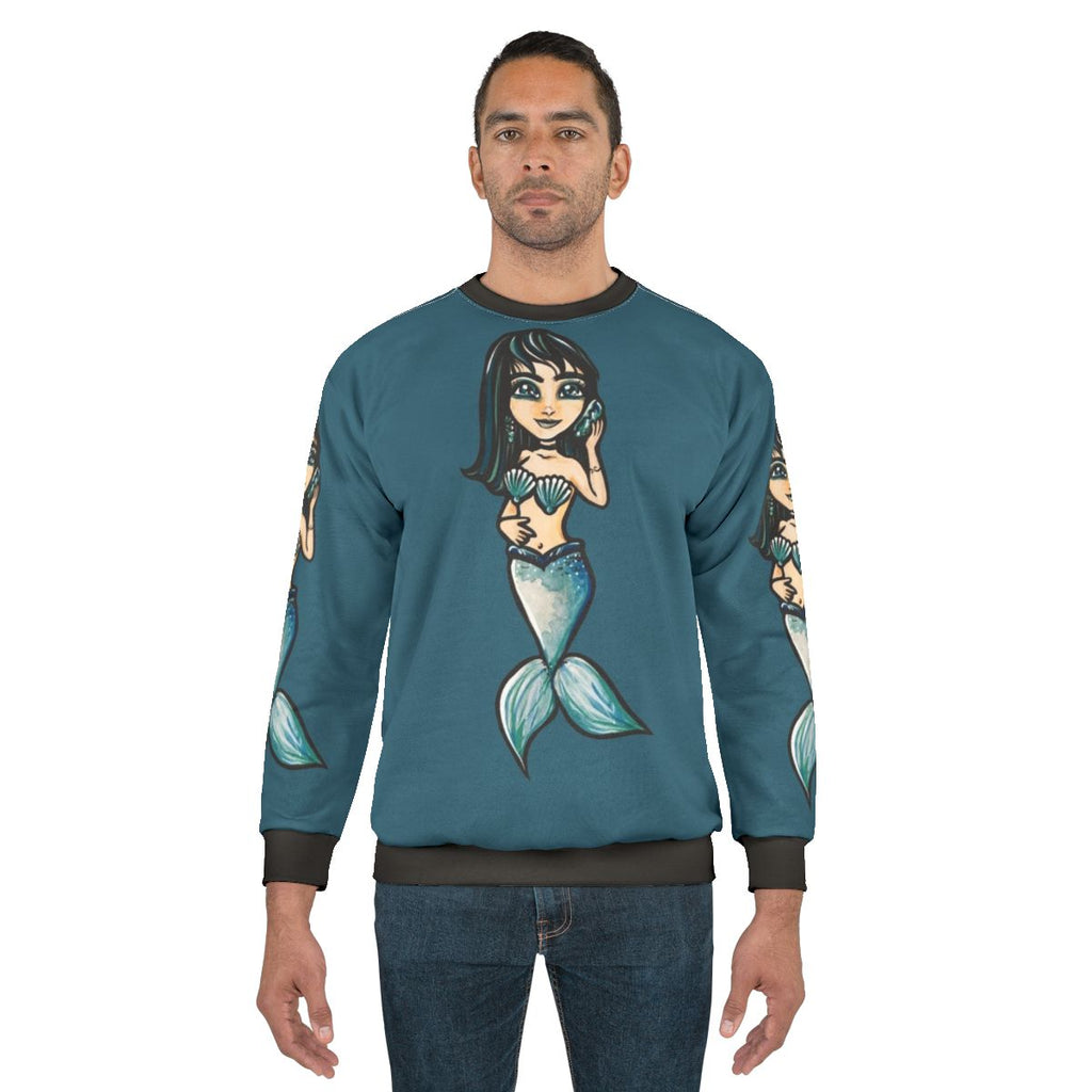 Mermaid sweatshirt with black hair and shell accessories