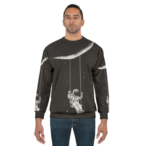 Astronomical moon swing sweatshirt with surreal, cosmic design