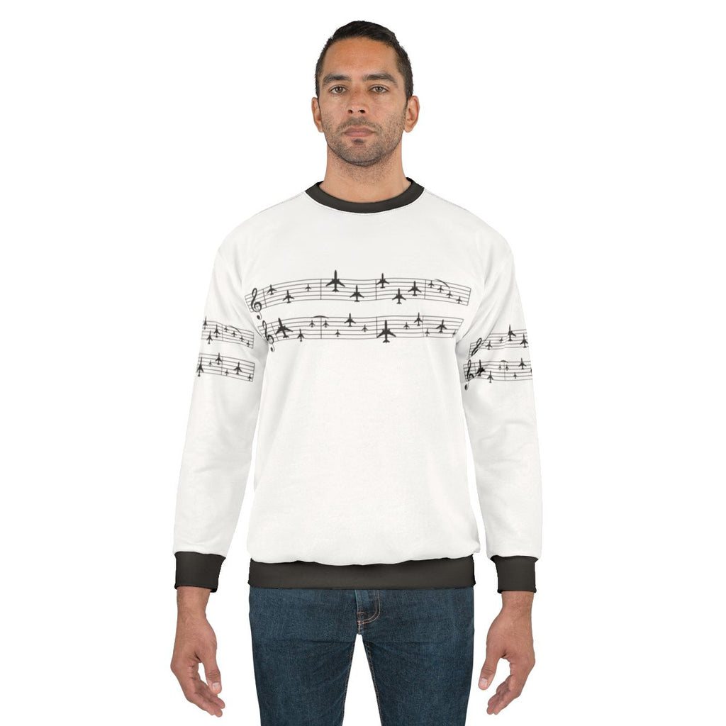Music staff with airplanes graphic on a white sweatshirt