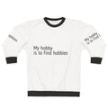 A person wearing a sweatshirt that reads "My Hobby Is To Find Hobbies"