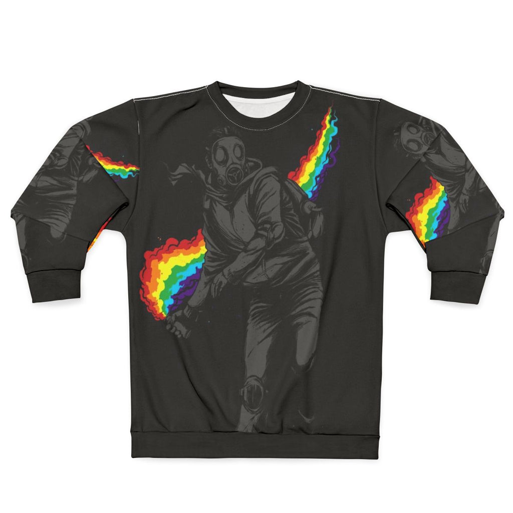 Colorful sweatshirt design with text "No More Tear Gas" against a background of political protest imagery