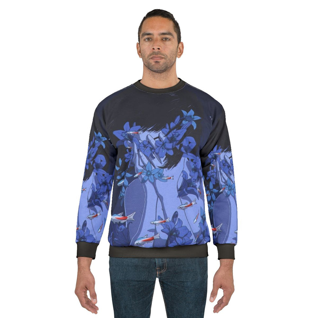 Blue sweatshirt with anime-style cartoon design featuring fish and flowers in a water-themed pattern