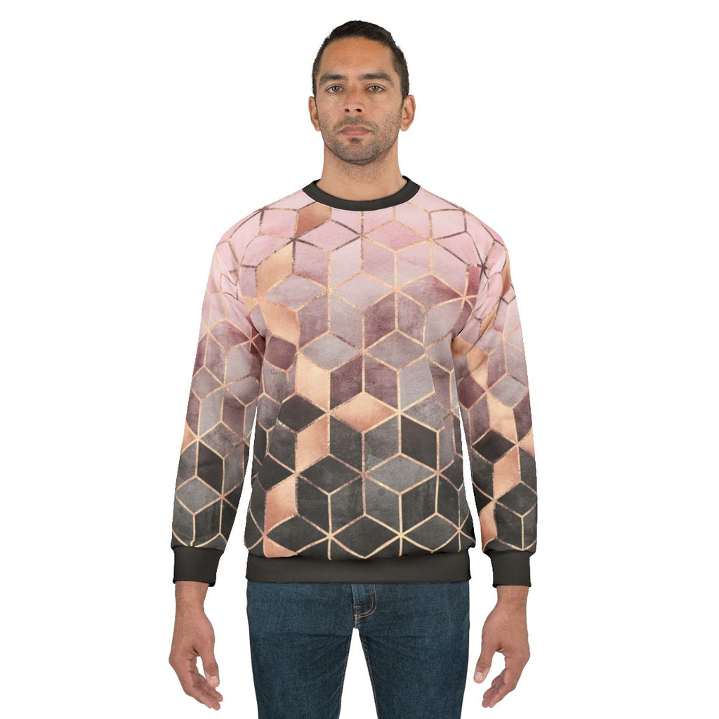 Modern gradient cubes pattern printed on a pink and grey sweatshirt