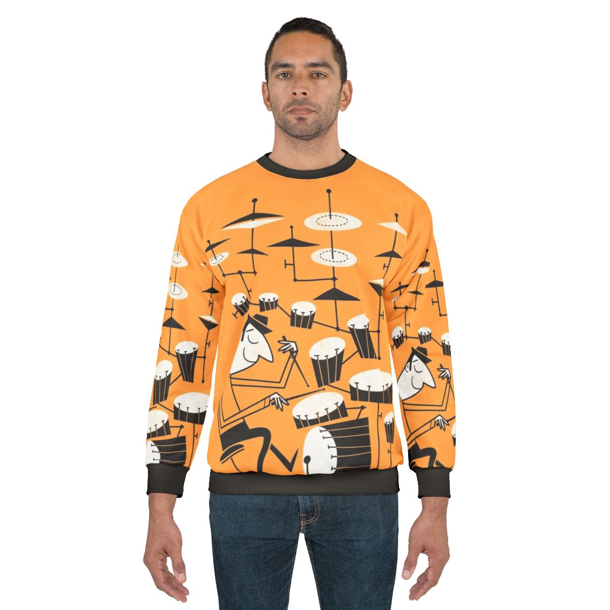 A person wearing a sweatshirt with a graphic design of drums and the text "Play That Beat"