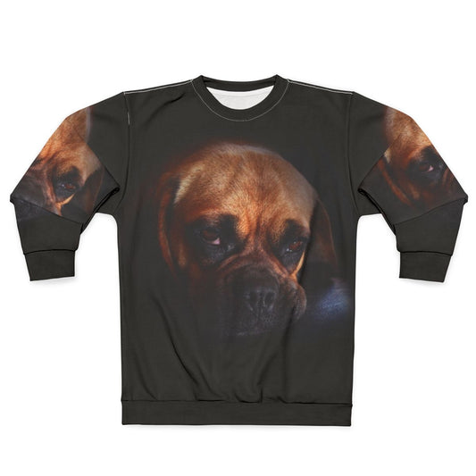 Cute puggle dog wearing a cozy sweatshirt
