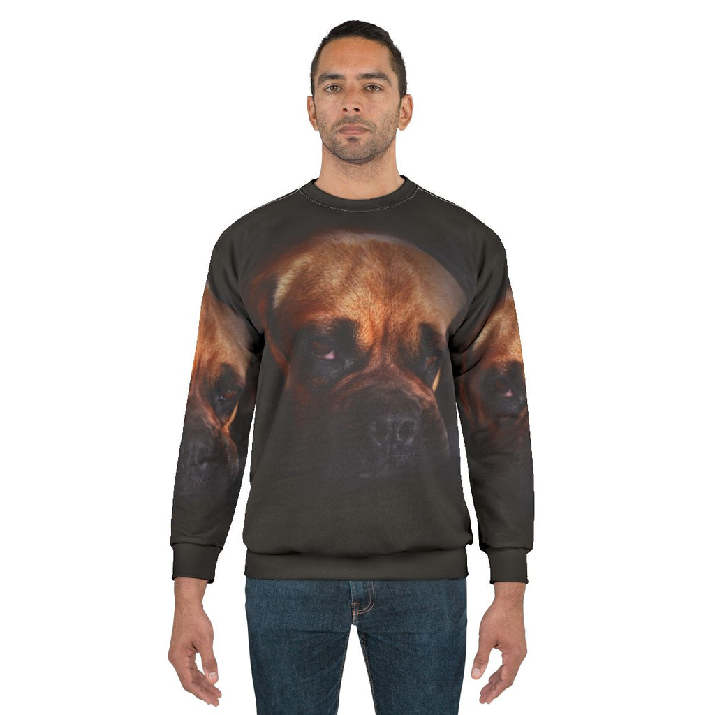 Cute puggle dog wearing a cozy sweatshirt