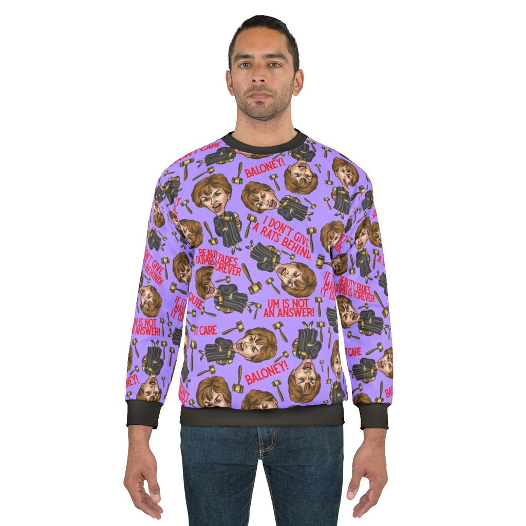 A purple sweatshirt featuring a print of TV personality Judge Judy