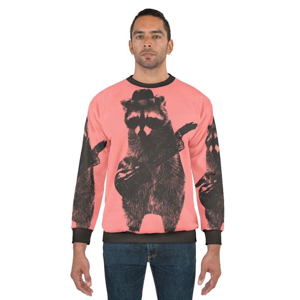 Raccoon holding a ukulele graphic sweatshirt