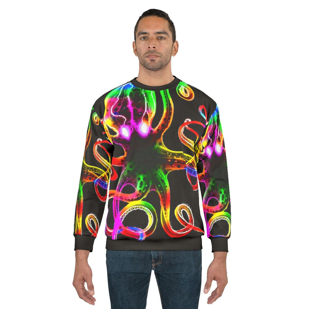 A vibrant rainbow octopus glowing in the dark on a sweatshirt