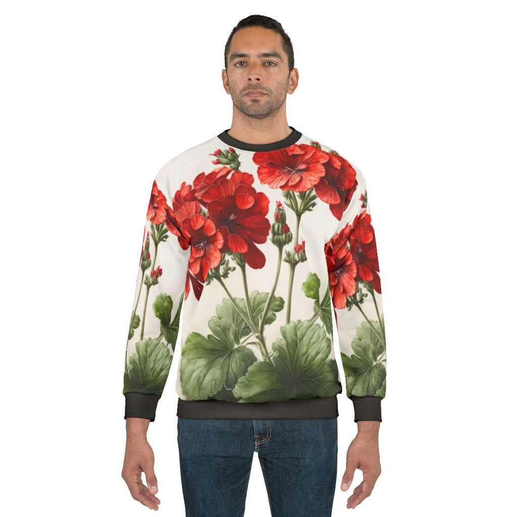 Red geranium flowers printed on a women's sweatshirt