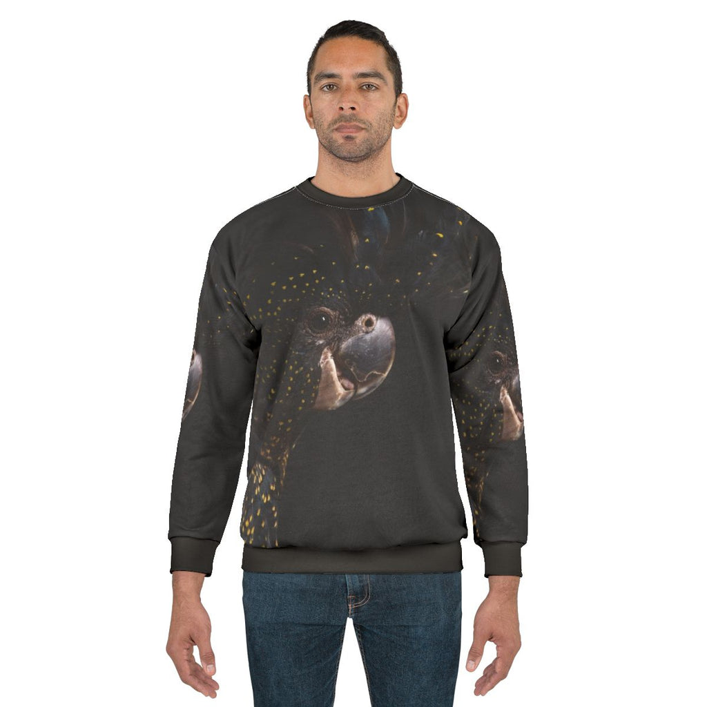 Red tailed black cockatoo bird on a sweatshirt