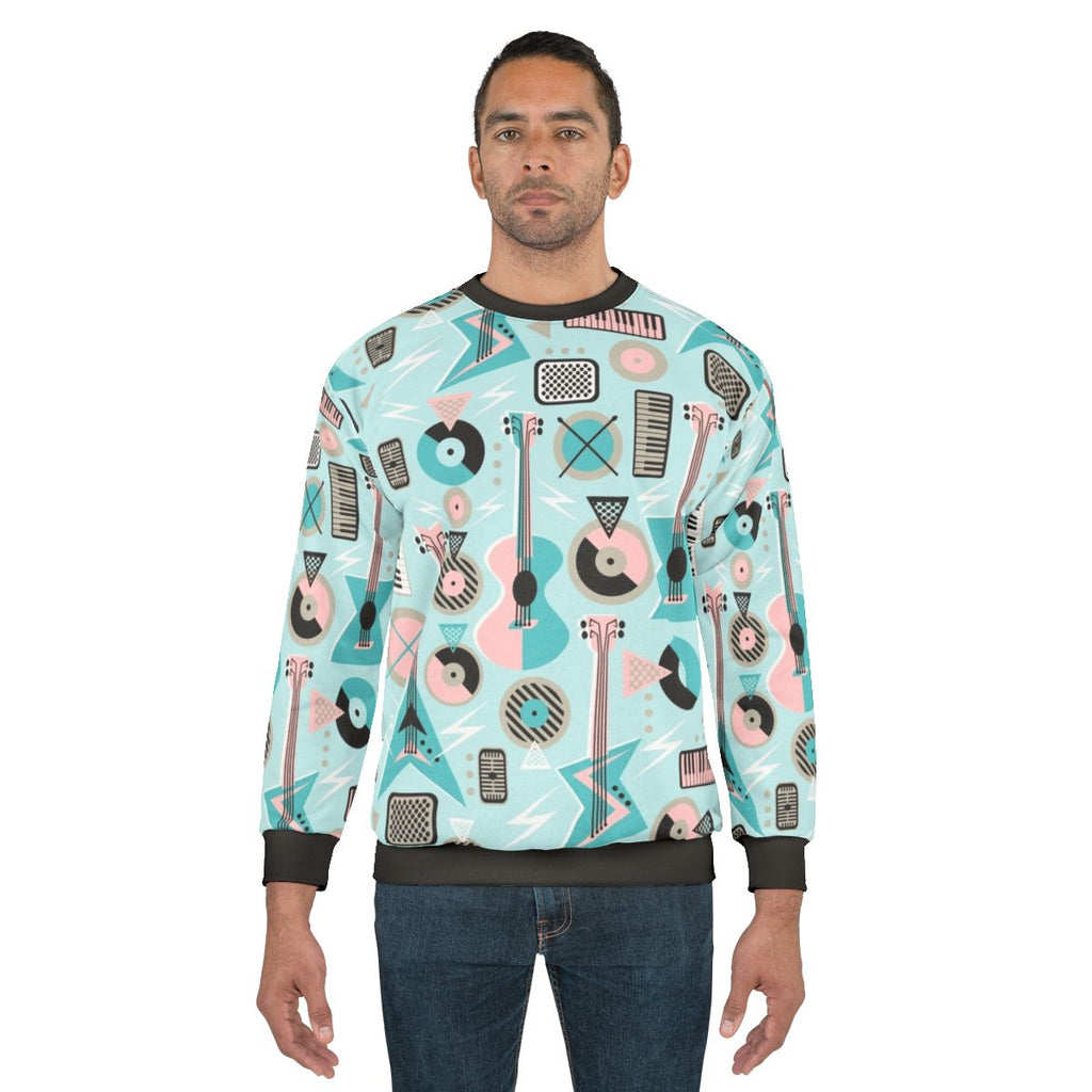 Retro musical mayhem turquoise sweatshirt with electric guitar art