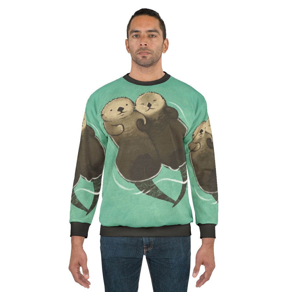 Significant otters holding hands printed on a cozy sweatshirt