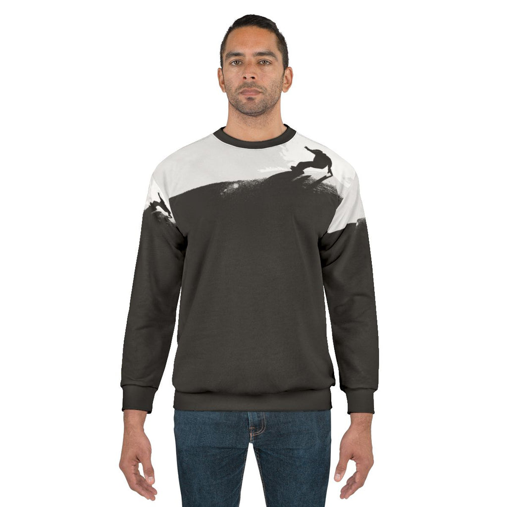 Snowboarder wearing a warm downhill sweatshirt on the slopes