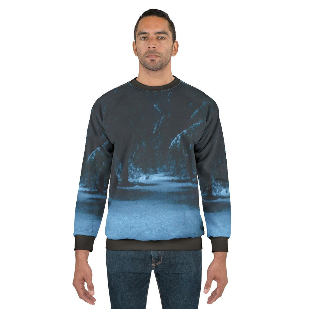 Snowy woods sweatshirt featuring a winter landscape design