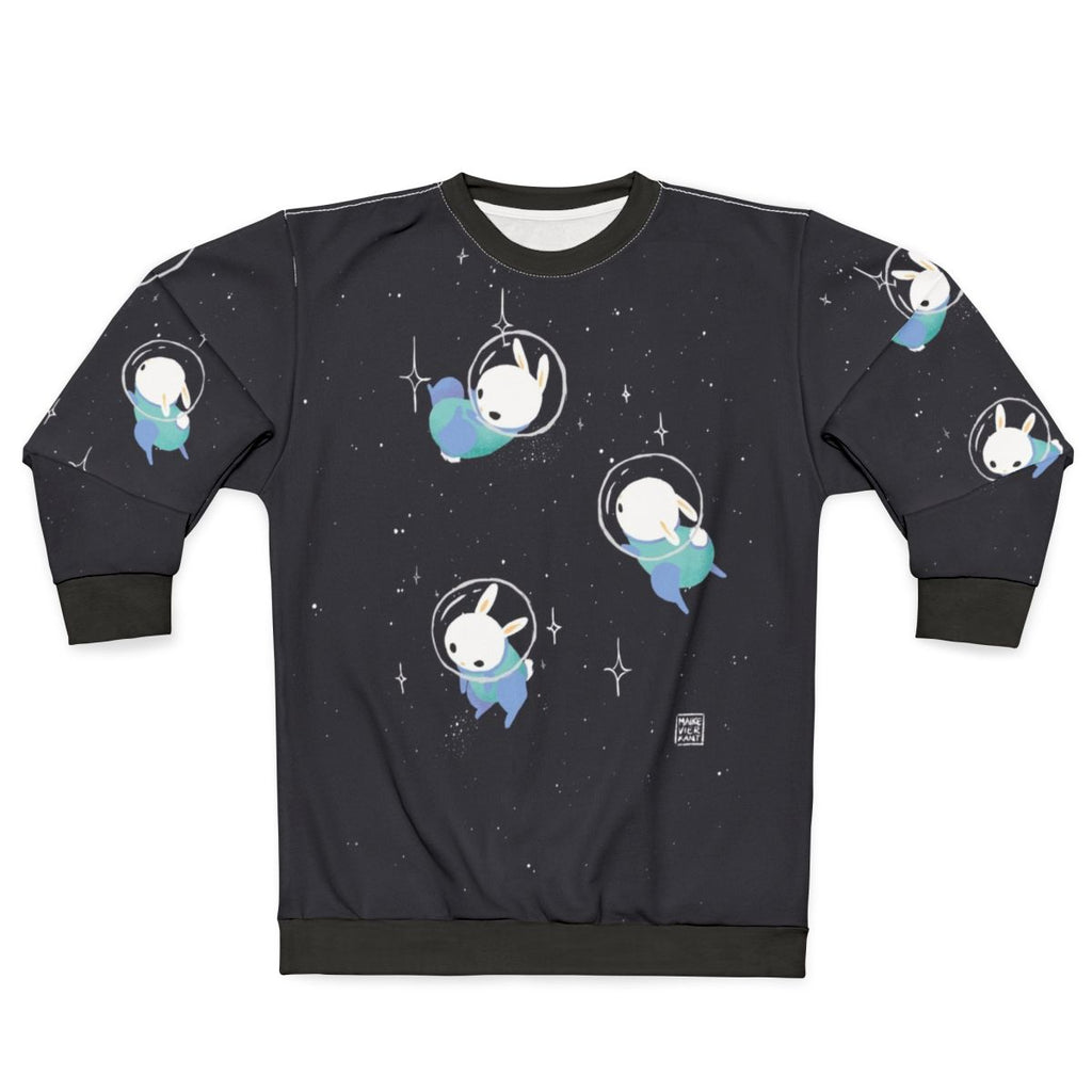A cute and cozy sweatshirt featuring digital illustrations of adorable space bunnies and rabbits exploring the cosmos