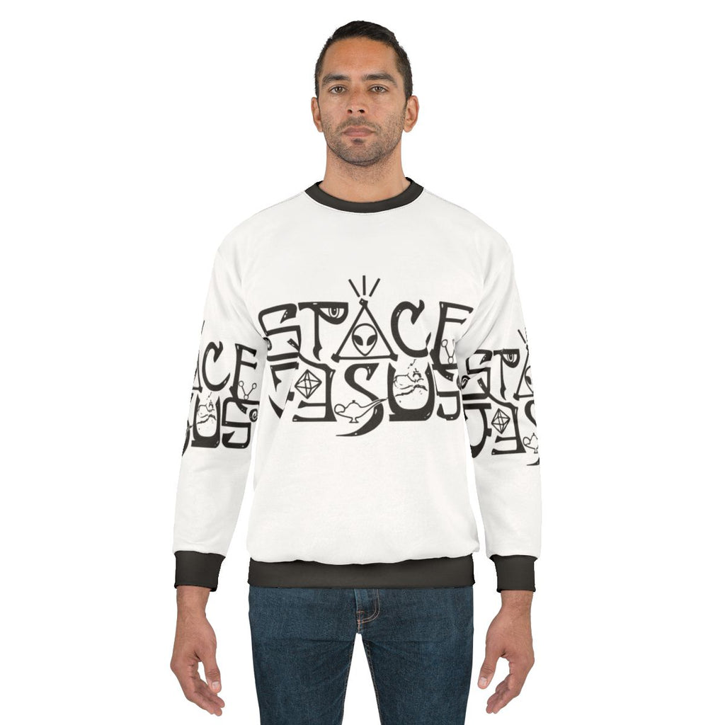 Space Jesus logo graphic on a black sweatshirt