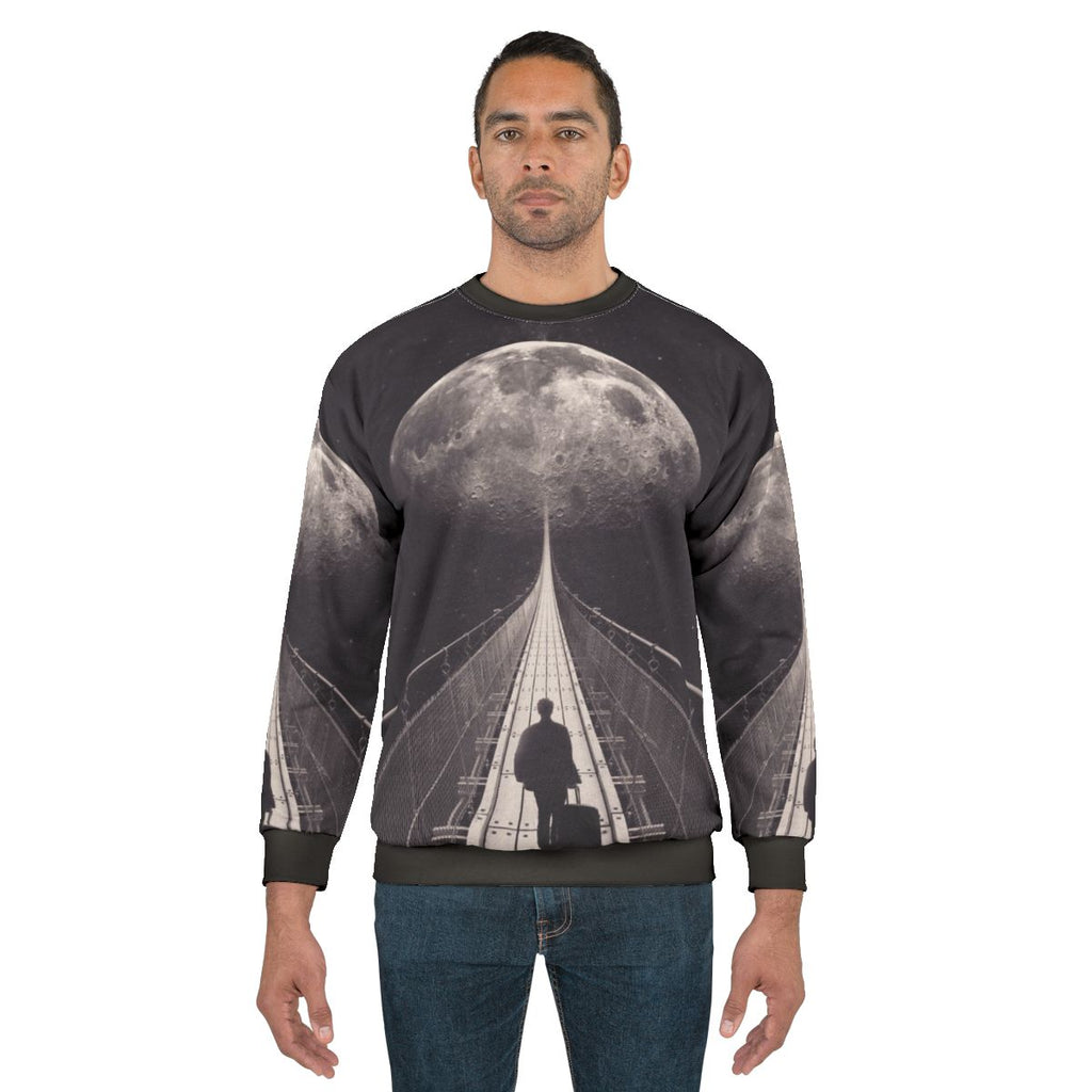 Man in space-themed sweatshirt floating in galaxy