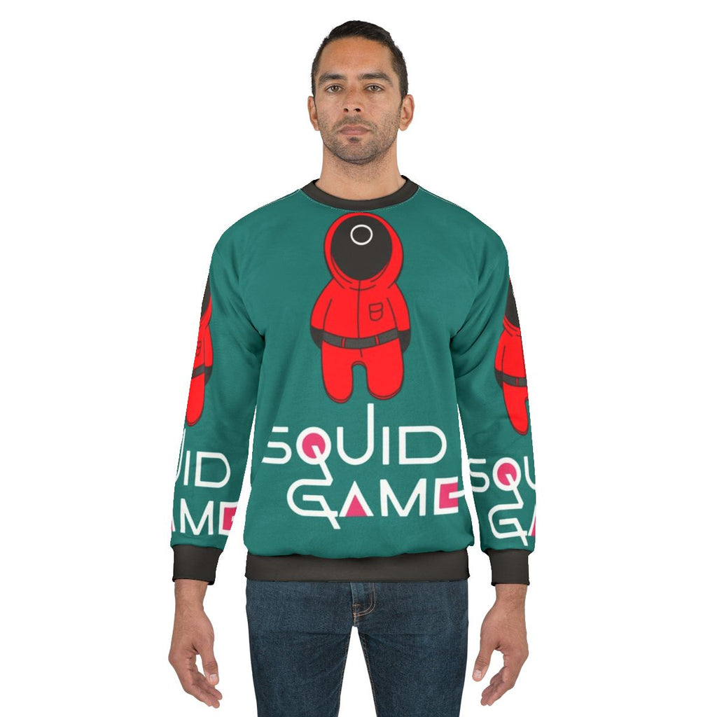 Squid Game Collection Sweatshirt featuring characters and symbols from the Netflix series