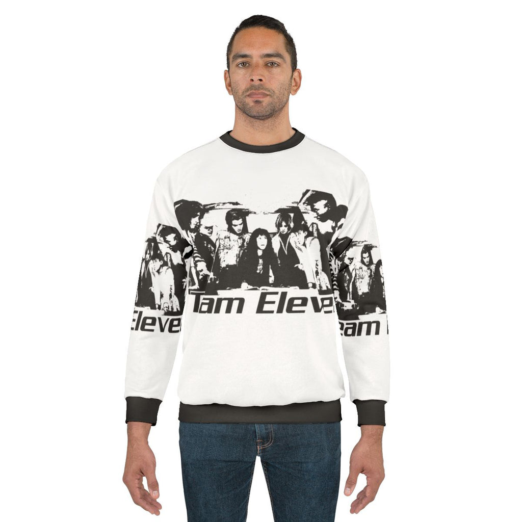 Eleven from Stranger Things wearing a cozy sweatshirt