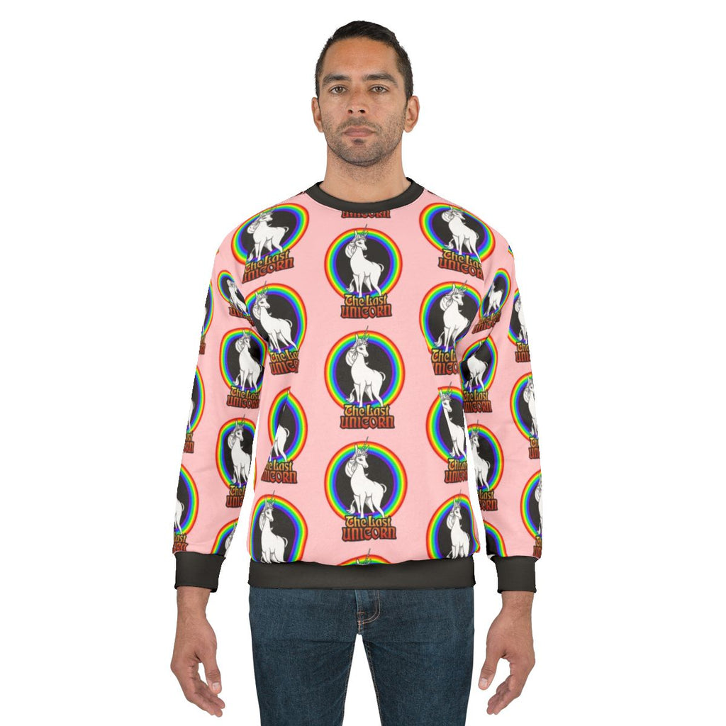 The Last Unicorn rainbow sweatshirt with a white unicorn and rainbow design