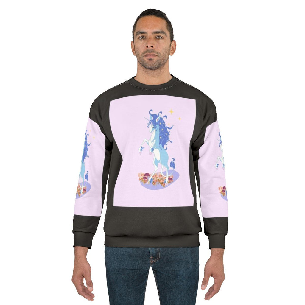 The Last Unicorn Sweatshirt featuring a whimsical unicorn design