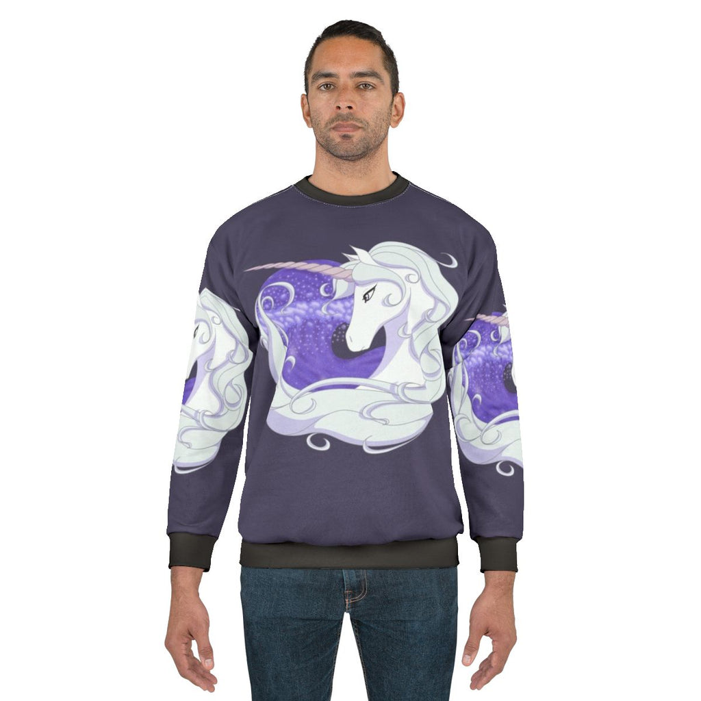 The Last Unicorn sweatshirt featuring a mythical unicorn swimming through ocean waves