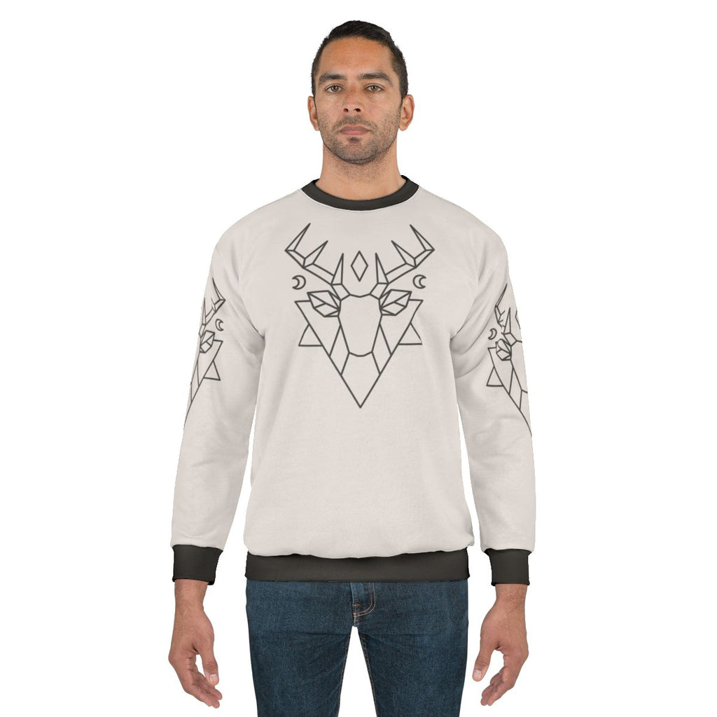 Mystic deer graphic sweatshirt with forest, moon, and stars design