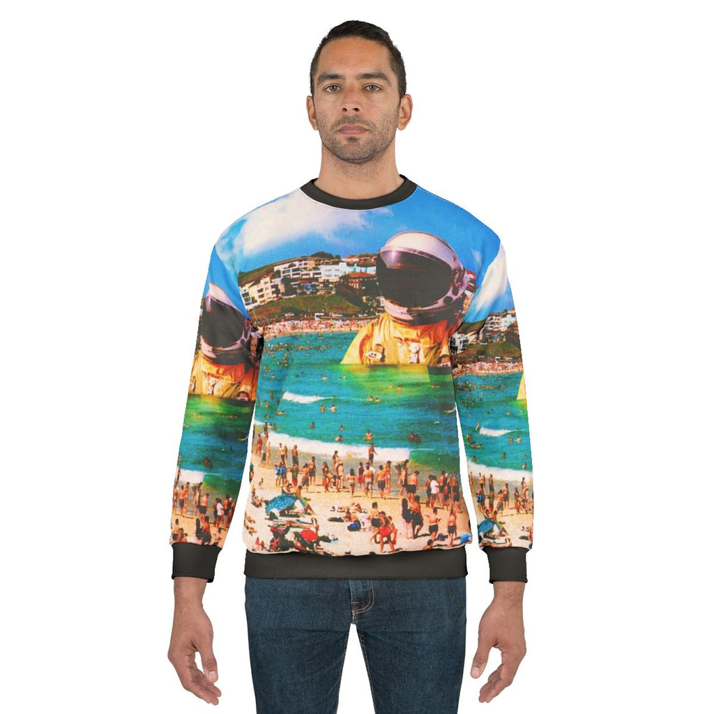 Surreal digital art sweatshirt featuring a beach astronaut in a collage design