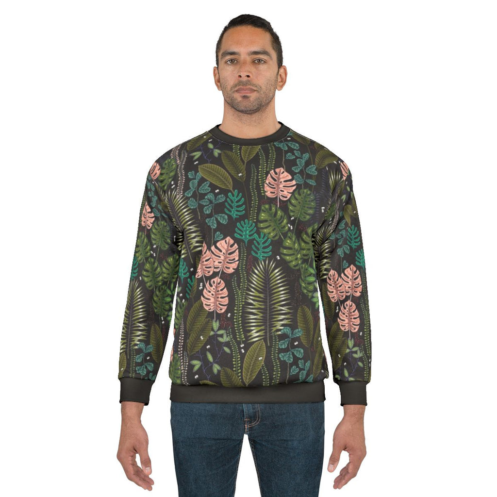 Tropical sweatshirt with monstera leaves and palm motifs