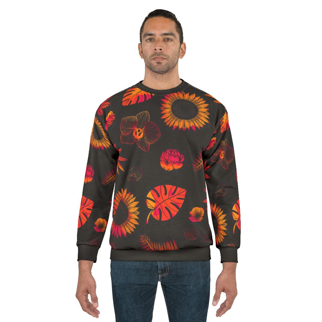 Tropical floral and leaf pattern printed on a sweatshirt