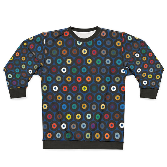 Vintage blue vinyl sweatshirt with retro graphic and polka dot pattern