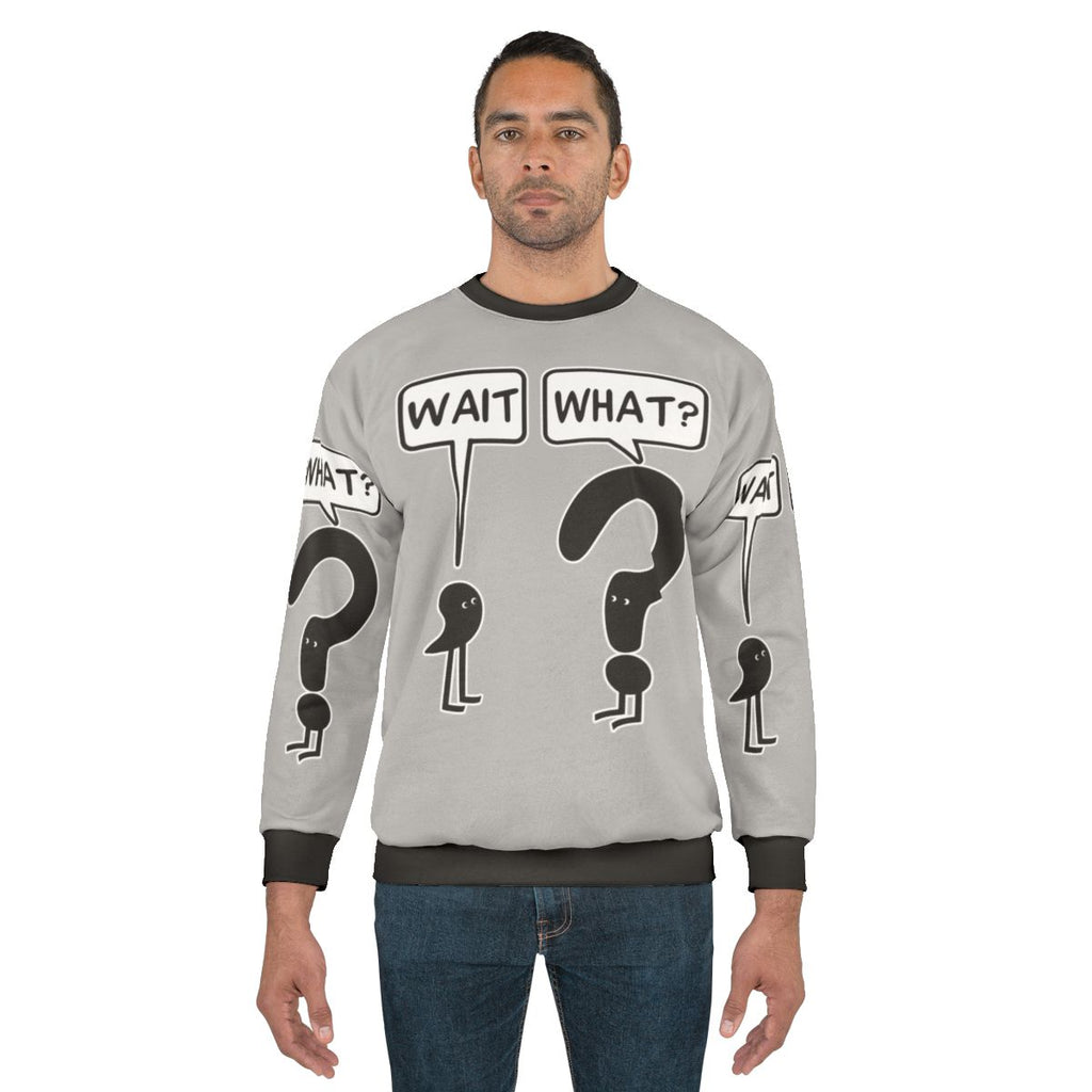 "Wait What" funny sweatshirt with text and illustration