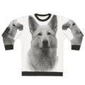 White German Shepherd wearing a cozy sweatshirt