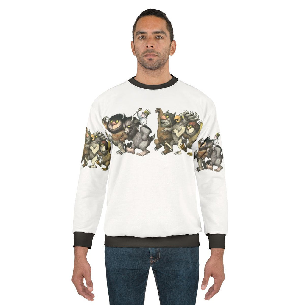 "Wild Things Romp" graphic sweatshirt featuring a monster design