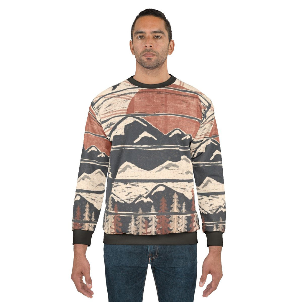 Person wearing winter sweatshirt in snowy mountain scenery