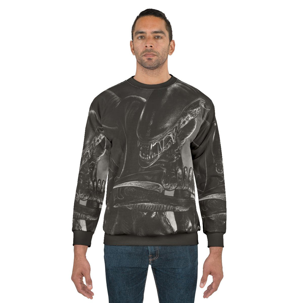 Handdrawn xenomorph alien design on a sweatshirt