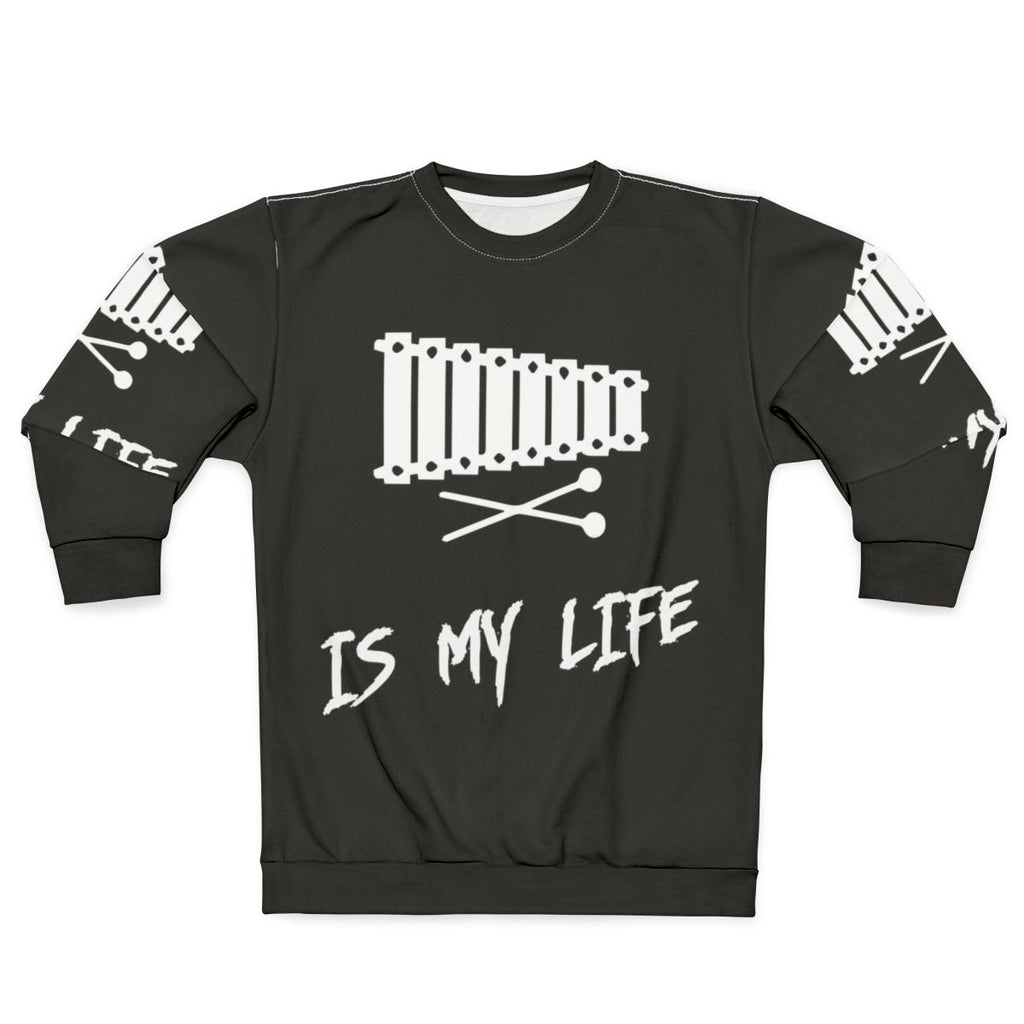 Person wearing a sweatshirt with the text "Xylophone Is My Life"